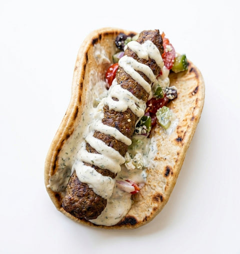 Greek-Style Lamb kofta in a Flat Bread with a Mint Yogurt & Greek salad